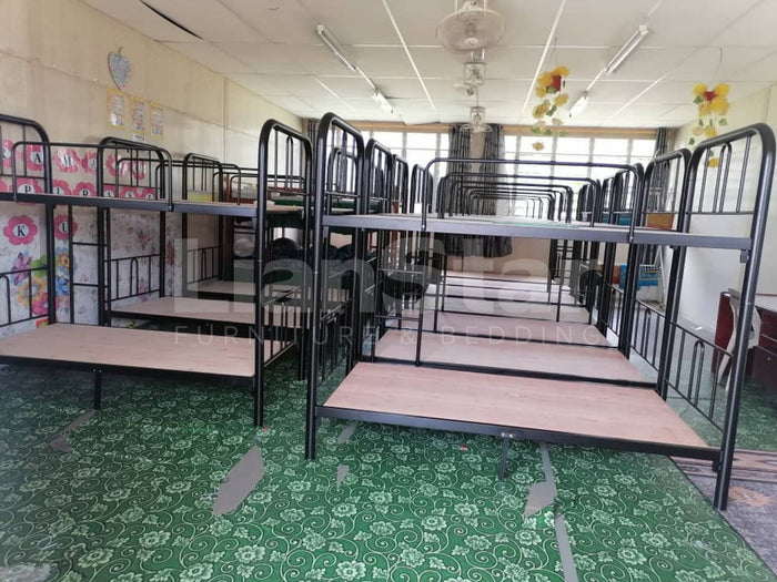 Rows of assembled metal bunk beds for the Saratok asrama project.