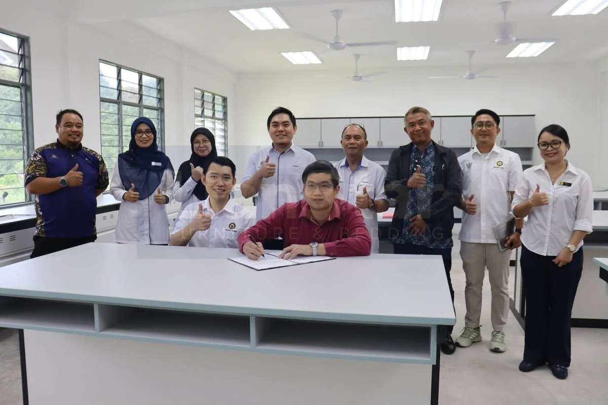 Group photograph around a larger desk.