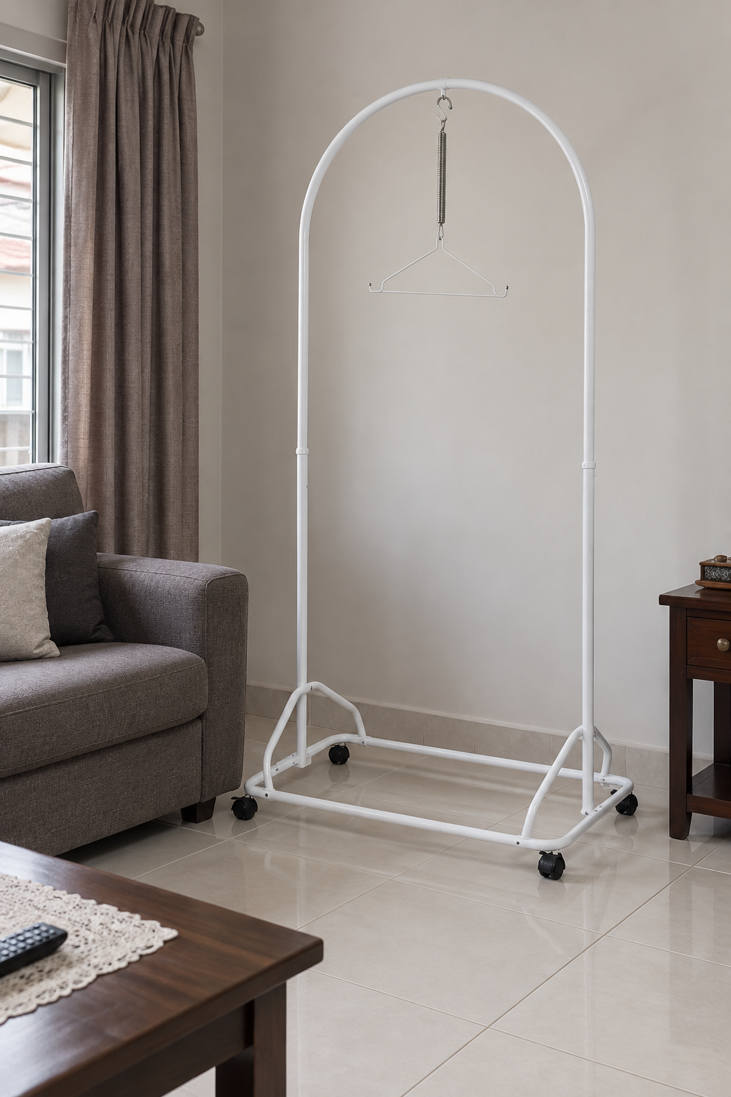 White baby spring cot stand in a Malaysian living room; sarong not included.