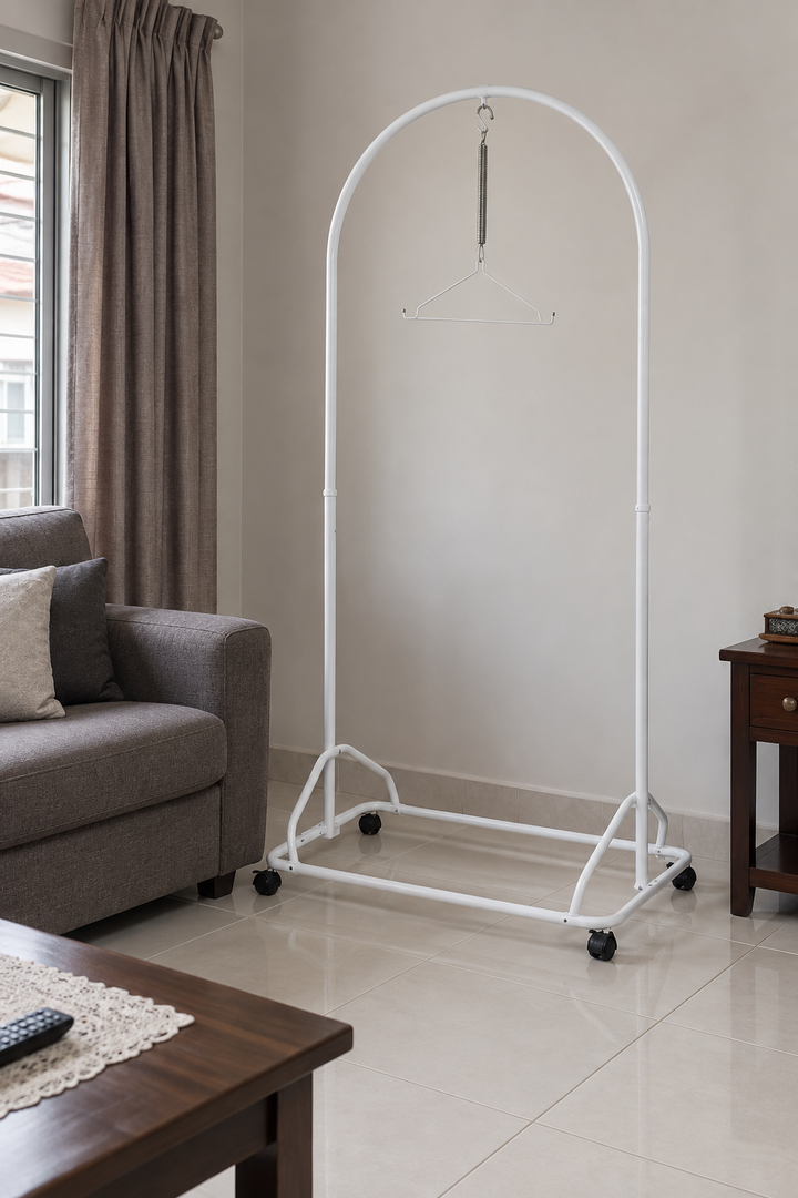 White baby spring cot stand in a Malaysian living room; sarong not included.