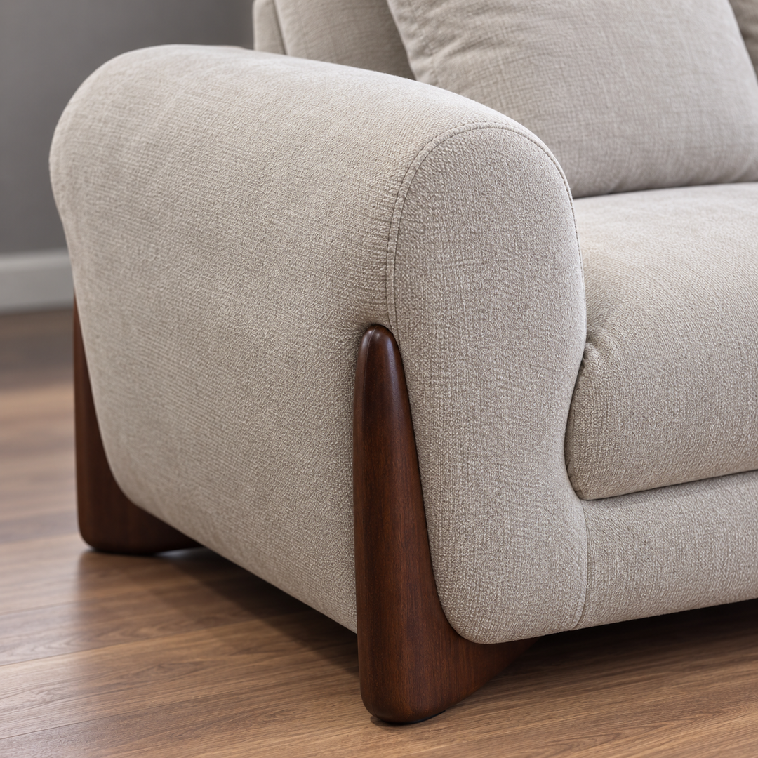 Rounded upholstered arm and dark curved side support