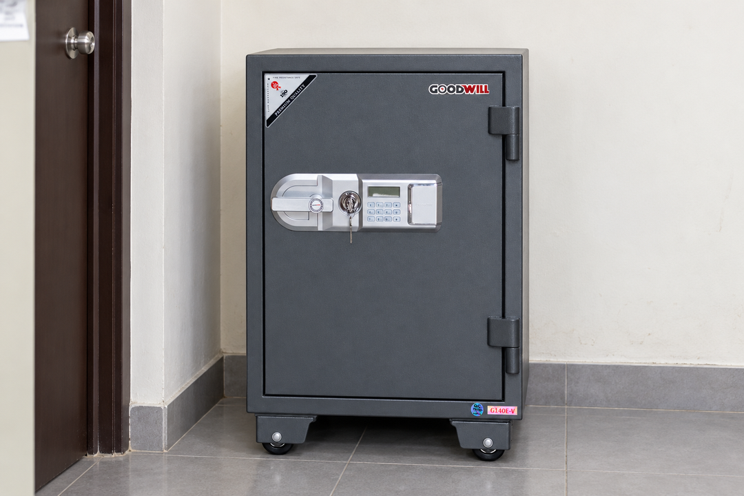 GoodWill G140E-V vertical digital safe in a Malaysian workplace, model-specific lifestyle image