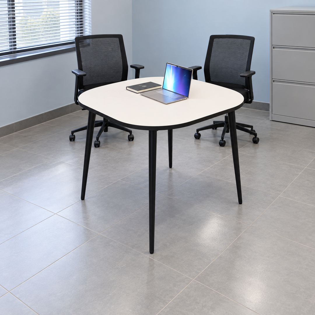 monochrome discussion rounded square — exact table configuration in a Malaysian office; chairs are styling references