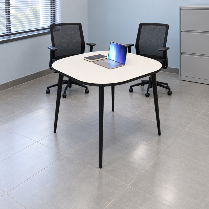 monochrome discussion rounded square — exact table configuration in a Malaysian office; chairs are styling references